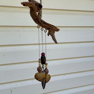 Driftwood Wind Chime with Natural Accents with fossil in middle.